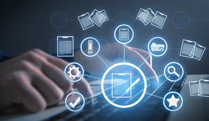 Hands typing at a laptop, ringed by document and checklist icons